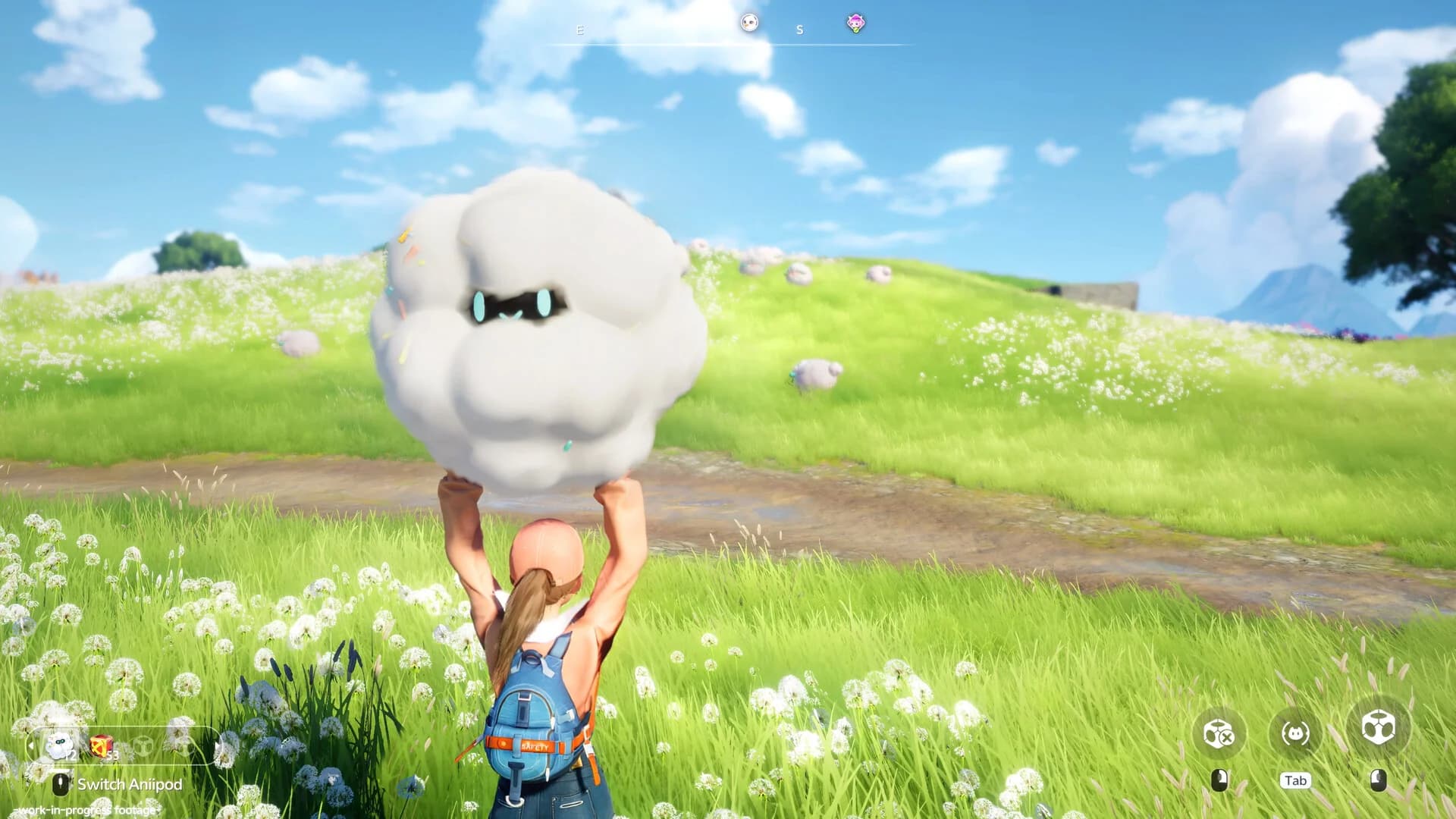 A Pathfinder holding a fluffy Aniimo in a flower-filled meadow in an official promotional screenshot.